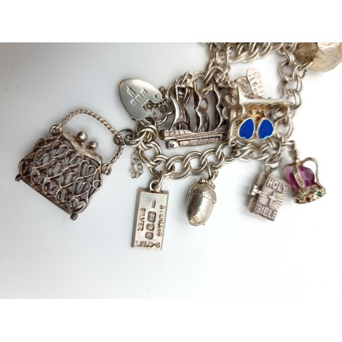 36 - A high quality charm bracelet, featuring a Lobster clasp and safety chain. This example features thi... 