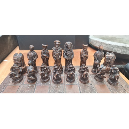 523 - Star lot : A fantastic figural chessboard with pieces inspired by Tudor England. Including a Queen E... 