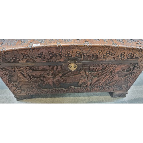 530 - Star Lot - A very large, lidded camphor chest. Cedar lined, with ornate, relief carving featuring Ja... 