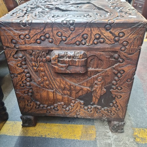 530 - Star Lot - A very large, lidded camphor chest. Cedar lined, with ornate, relief carving featuring Ja... 