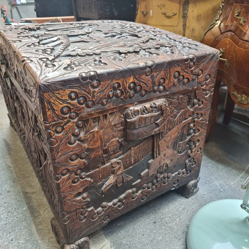 530 - Star Lot - A very large, lidded camphor chest. Cedar lined, with ornate, relief carving featuring Ja... 