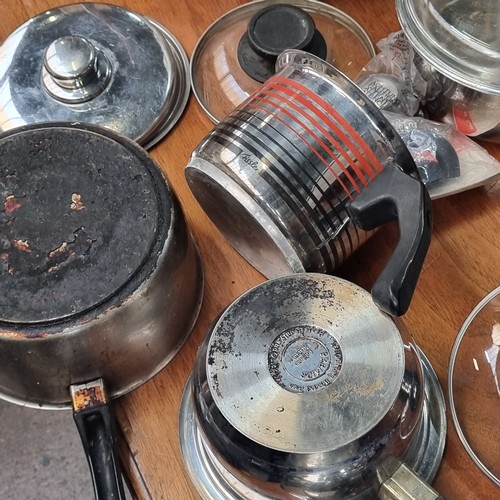 544 - A selection of seven stainless steel saucepans. Including matching lids.