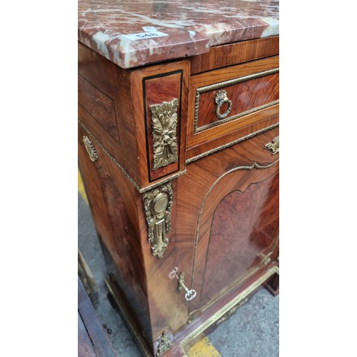 548 - Star lot : An elegant French style drinks cabinet with a bevelled red cold marble top with white vei... 