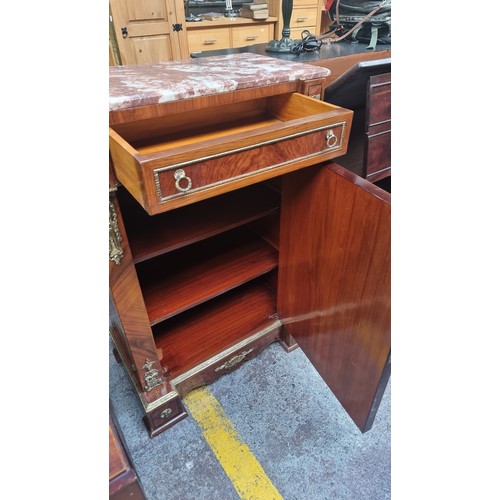 548 - Star lot : An elegant French style drinks cabinet with a bevelled red cold marble top with white vei... 