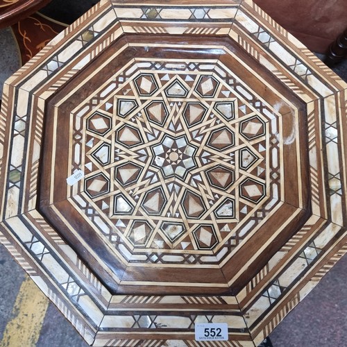 552 - Star lot : An octagonal side table, profusely inlaid with bone and mother of pearl in a geometric pa... 