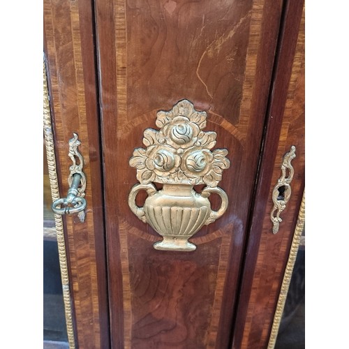 571 - Star Lot : A wonderfully grand credenza with two shelves inside, beautiful bow front glass doors and... 