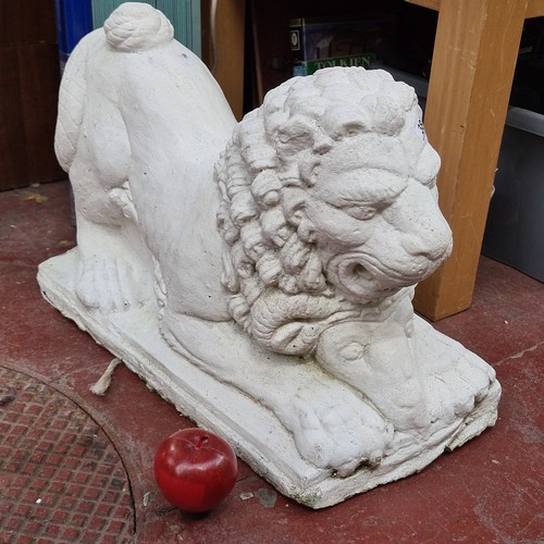 387 - A very heavy, concrete garden lion ornament with a ram, finished in matte white. H38cm x L56cm. A go... 