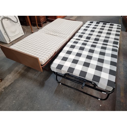 759 - Two camp beds that fold for away for easy storage. Both include single mattress to top. Might be han... 