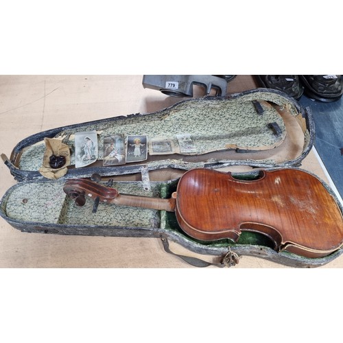 766 - An antique full size violin in original case. Needs some restoration.