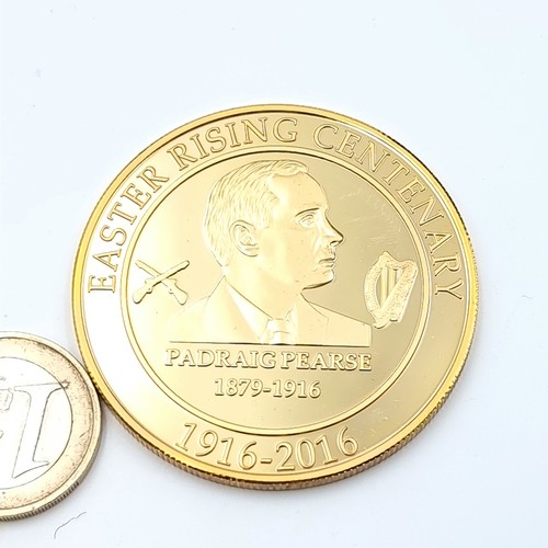 20 - A commemorative medallion celebrating the Easter Rising Centenary and depicting a Padraig Pearce bus... 