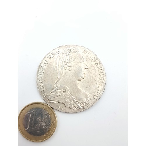 411 - A Marie Theresa Austrian bullion silver coin, weight: 28.11 grams. In fine condition.