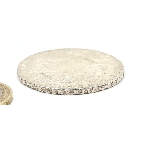 411 - A Marie Theresa Austrian bullion silver coin, weight: 28.11 grams. In fine condition.