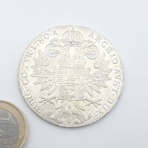 411 - A Marie Theresa Austrian bullion silver coin, weight: 28.11 grams. In fine condition.