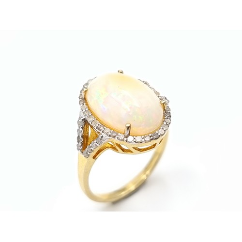 437 - Star Lot : A fabulous  beautiful large Australian Fire Opal and Diamond ring, with a beautiful hued ... 