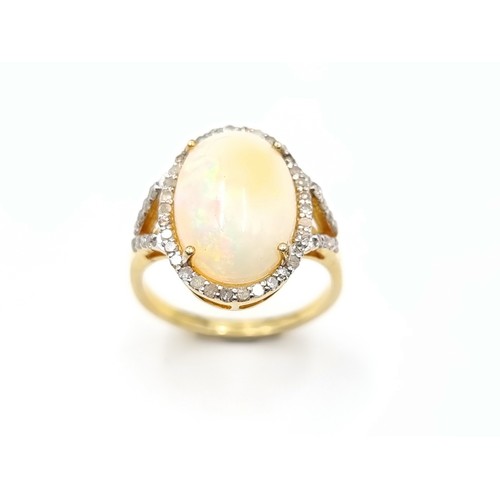 437 - Star Lot : A fabulous  beautiful large Australian Fire Opal and Diamond ring, with a beautiful hued ... 