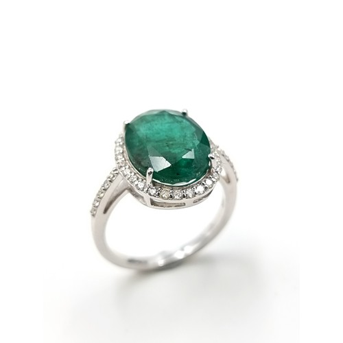 438 - Super Star Lot: An exceptional example of an oval Emerald and Diamond 14 carat white Gold ring, whic... 