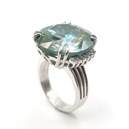 439 - A mesmerising Ocean Blue Moissanite ring, of an immense 25.5 carats and set in sterling silver. Ring... 