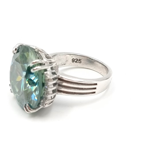 439 - A mesmerising Ocean Blue Moissanite ring, of an immense 25.5 carats and set in sterling silver. Ring... 