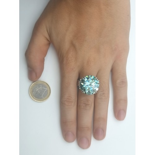 439 - A mesmerising Ocean Blue Moissanite ring, of an immense 25.5 carats and set in sterling silver. Ring... 