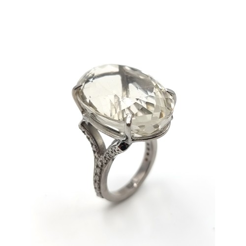 442 - A striking huge Lemon Quartz and Diamond sterling silver ring, with a truly huge centre stone of 48.... 