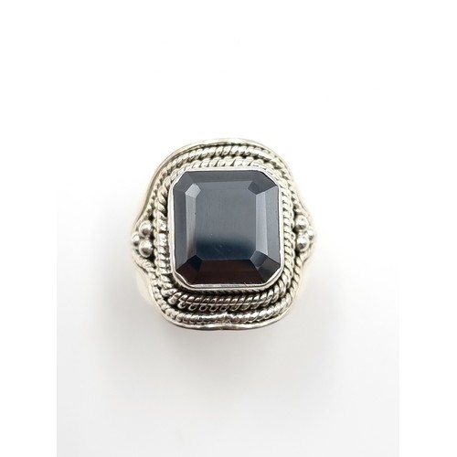 449 - A fine example of a Gents Onyx Moissanite rectangular cut ring, of 6 carats and set beautifully in s... 