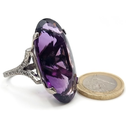 445 - Star lot : A rare huge Bolivian Amethyst ring, of an immense 60 carats with .55 carats of Diamonds t... 