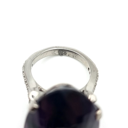 445 - Star lot : A rare huge Bolivian Amethyst ring, of an immense 60 carats with .55 carats of Diamonds t... 