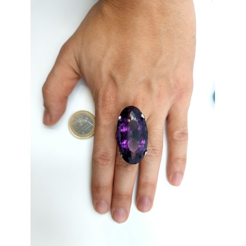 445 - Star lot : A rare huge Bolivian Amethyst ring, of an immense 60 carats with .55 carats of Diamonds t... 