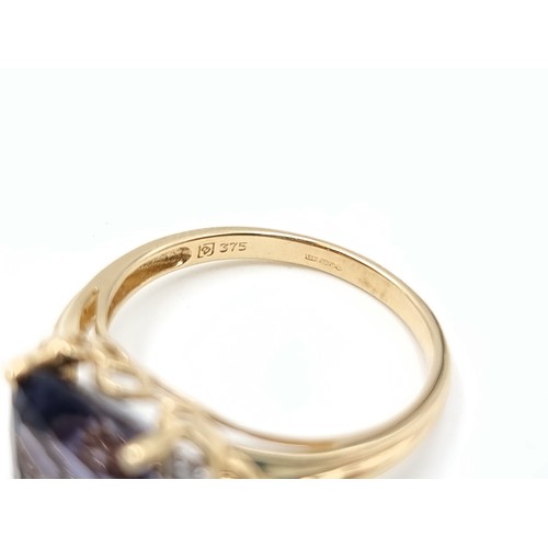 667 - Star lot : A beautiful 9 carat gold Amythyst and Diamond ring of a generous 5.9 carats and set with ... 