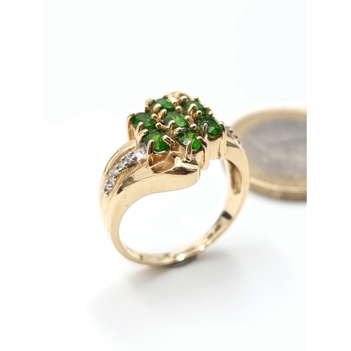 668 - Star lot : A fabulous 14 carat gold vintage seven stone Diopside and Diamond dress ring, with an att... 