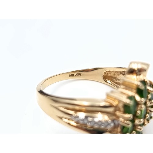 668 - Star lot : A fabulous 14 carat gold vintage seven stone Diopside and Diamond dress ring, with an att... 