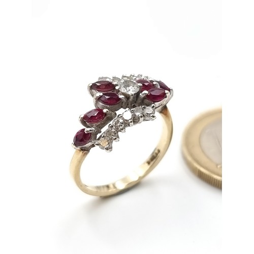 672 - A fine example of an eight stone 9 carat gold ruby stone dress ring, which features a Daimond settin... 