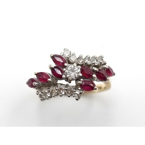 672 - A fine example of an eight stone 9 carat gold ruby stone dress ring, which features a Daimond settin... 