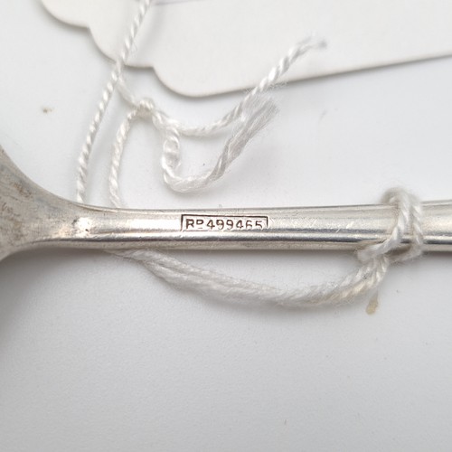 904 - A lovely Sterling Silver, heavy tea spoon with a gentleman with rifle and lady with bow on the top a... 