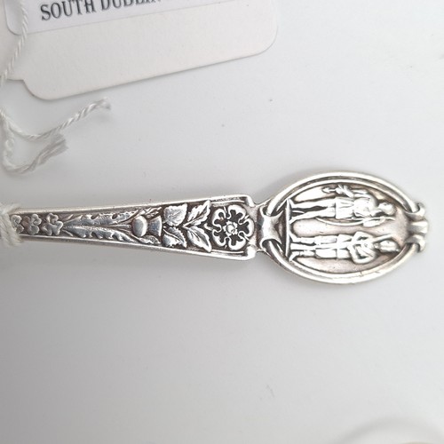 904 - A lovely Sterling Silver, heavy tea spoon with a gentleman with rifle and lady with bow on the top a... 