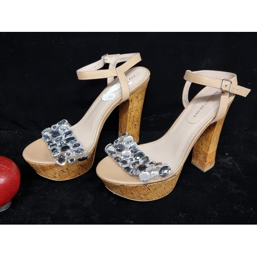 188 - A pair of as new Kurt Geiger designer platform heals with a lacquered cork platform and a diamante s... 