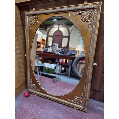 458 - A very impressive hall mirror by Larson Juhl. The oval mirror is set into a wonderfully opulent gilt... 