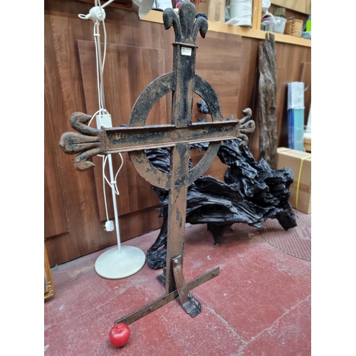 460 - Star Lot : A very heavy 19th century cast metal cross. Featuring fleur-de-lys finials. Ideal for flo... 