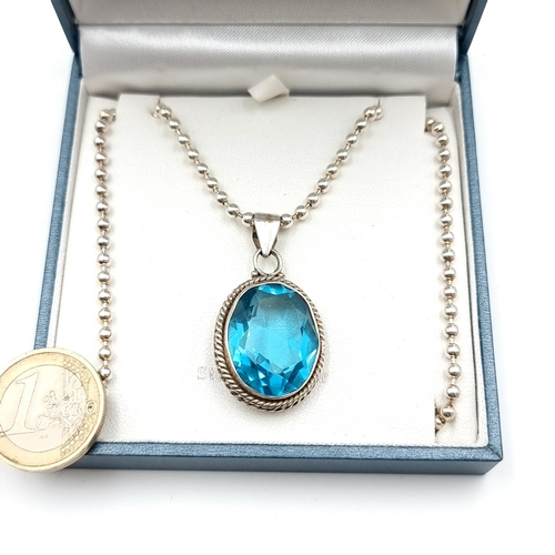 653 - A show stopping vintage facet cut Topaz stone pendant, set with sterling silver mount and a sterling... 