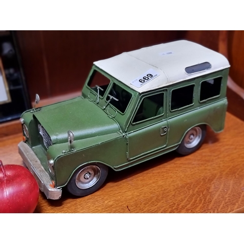 669 - A large cast metal Dune Jeep model car with fully rotational and realistic looking wheels. With spar... 