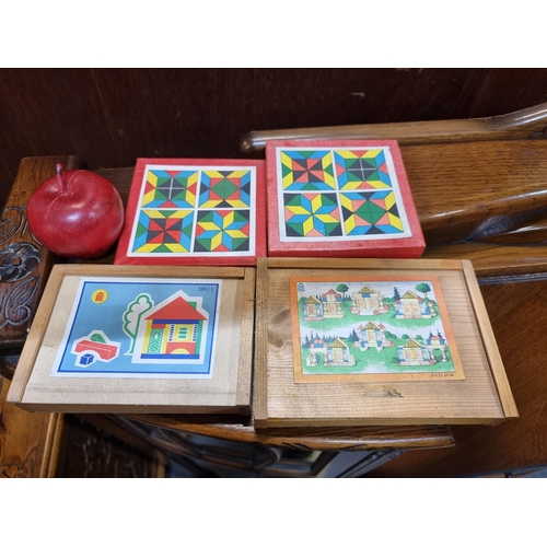 678 - Four complete sets of vintage wooden block shape puzzle games, including two house puzzles and two K... 