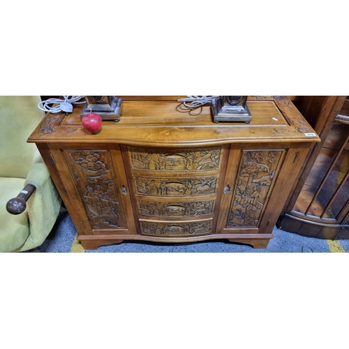 679 - Star lot : A fabulous Chinese Rosewood credenza with four drawers to front flanked by two cupboards ... 