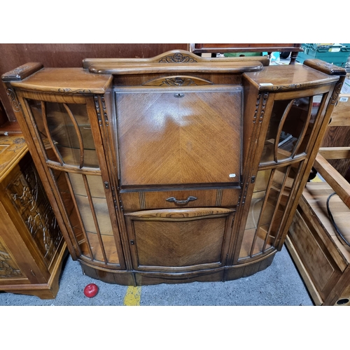 680 - Star lot : A fantastic Art Deco writing table with two astroglazed display cabinets to each side wit... 