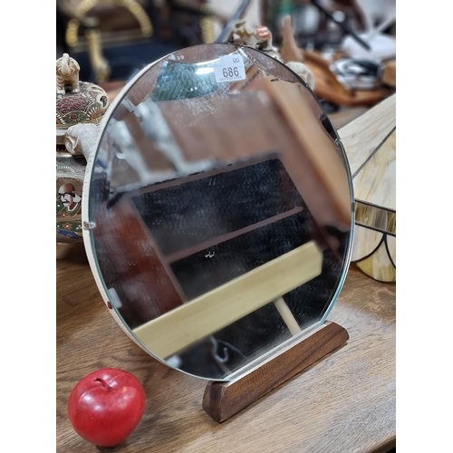 686 - A lovely mid century bevelled circular vintage table vanity mirror with wooden stand.