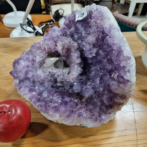 691 - Star lot : A very large, very heavy geode of amethyst crystal with a rare white natural Crystal inte... 