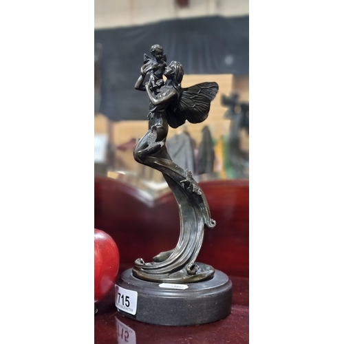 715 - Star lot : A heavy cast bronze  sculpture of a fairy embracing a fae child. Lovely casting, really n... 