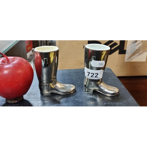 722 - A pair of silver plated, riding boot jiggers. (Spirit measures) Measuring 1oz apiece. Featuring orig... 