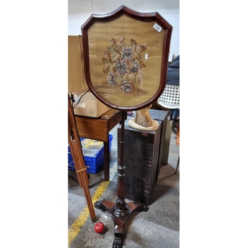 725 - Star lot : An unusual example of an Irish Victorian, mahogany fire pole screen. Featuring an adjusta... 