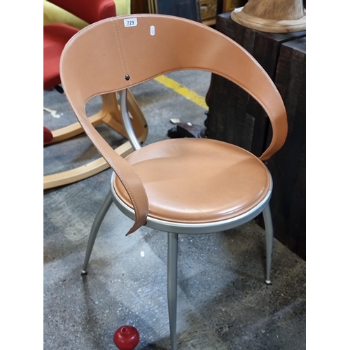 729 - An Italian made Calligaris designer open back tub chair with tan leather upholstery and saddle stitc... 