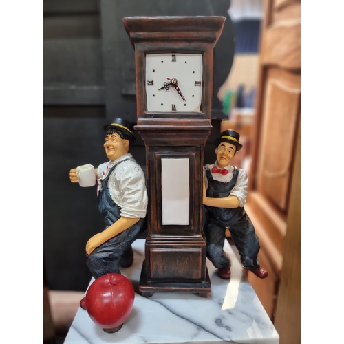 742 - A characterful miniature grandfather clock, perfect for a desk or mantle. Flanked by the very distin... 